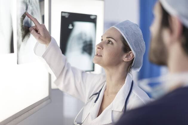 Doctor in hospital, radiologists discussing model released Symbolfoto property released  ZEF007327