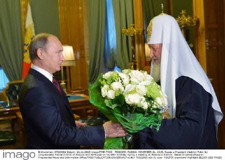 MOSCOW, RUSSIA. NOVEMBER 21, 2015. Russia s President Vladimir Putin (L) congratulates Patriarch Kirill of Moscow and All Russia on his 69th birthday during a meeting at Moscow s Kremlin. Alexei Druzhinin Russian Presidential Press and Information Office TASS  TS012505