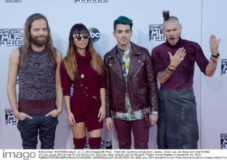From left, recording artists Jack Lawless, JinJoo Lee, Joe Jonas and Cole Whittle of music group DNC arrives for the 43rd annual American Music Awards held at Microsoft Theater in Los Angeles on November 22, 2015.  LAP20151122269 JIMxRUYMEN