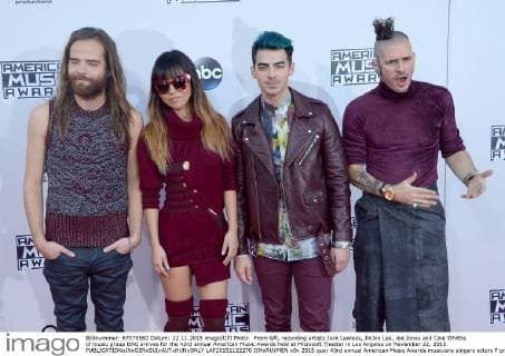 From left, recording artists Jack Lawless, JinJoo Lee, Joe Jonas and Cole Whittle of music group DNC arrives for the 43rd annual American Music Awards held at Microsoft Theater in Los Angeles on November 22, 2015.  LAP20151122270 JIMxRUYMEN