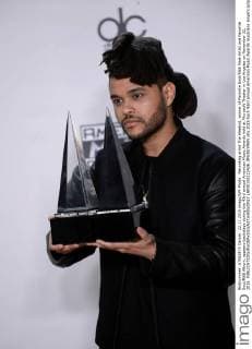 Recording artist The Weeknd, winner of Favorite Soul R&B Male Artist and Favorite Soul R&B Album, appears backstage during the 43rd annual American Music Awards held at Microsoft Theater in Los Angeles on November 22, 2015.  LAP20151122426 JIMxRUYMEN