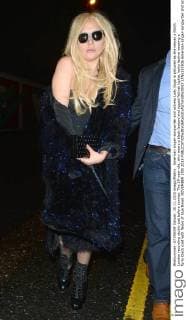 American singer-songwriter and actress Lady Gaga is pictured as she leaves a North London recording studio just before sunrise. The 29-year-old, who wears a black leotard and ripped fishnet tights, looks festive wearing a furry black coat with flecks of blue tinsel. NOVEMBER 25th 2015  LTNx153506