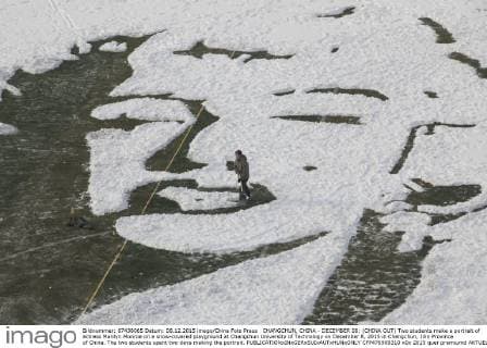 CHANGCHUN, CHINA - DECEMBER 08: (CHINA OUT) Two students make a portrait of actress Marilyn Monroe on a snow-covered playground at Changchun University of Technology on December 8, 2015 in Changchun, Jilin Province of China. The two students spent two days making the portrait.  CFP476909310