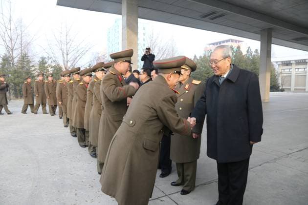 (151209) -- PYONGYANG, Dec. 9, 2015 -- Secretary of the Central Committee of the ruling Workers Party of Korea Kim Ki Nam (1st R) shakes hands with members of music groups in Pyongyang, DPRK, on Dec. 9, 2015. Two renowned music groups of the Democratic People s Republic of Korea (DPRK) on Wednesday left for Beijing for performances in China. ) DPRK-PYONGYANG-CHINA-MUSIC GROUPS GuoxYina 