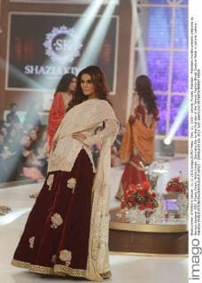 Dec. 11, 2015 - Lahore, Punjab, Pakistan - Pakistani models present creations by famous designer HSY, Shazia Kiyani, Aisha Imran, Zarmisha Dar on the first day of the Telenor Fashion Bridal Couture Week in Lahore. Lahore Pakistan - ZUMAp133