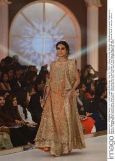 Dec. 11, 2015 - Lahore, Punjab, Pakistan - Pakistani models present creations by famous designer HSY, Shazia Kiyani, Aisha Imran, Zarmisha Dar on the first day of the Telenor Fashion Bridal Couture Week in Lahore. Lahore Pakistan - ZUMAp133