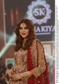 Dec. 11, 2015 - Lahore, Punjab, Pakistan - Pakistani models present creations by famous designer HSY, Shazia Kiyani, Aisha Imran, Zarmisha Dar on the first day of the Telenor Fashion Bridal Couture Week in Lahore. Lahore Pakistan - ZUMAp133