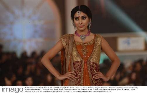 Dec. 11, 2015 - Lahore, Punjab, Pakistan - Pakistani models present creations by famous designer HSY, Shazia Kiyani, Aisha Imran, Zarmisha Dar on the first day of the Telenor Fashion Bridal Couture Week in Lahore. Lahore Pakistan - ZUMAp133