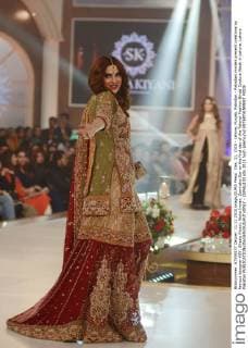 Dec. 11, 2015 - Lahore, Punjab, Pakistan - Pakistani models present creations by famous designer HSY, Shazia Kiyani, Aisha Imran, Zarmisha Dar on the first day of the Telenor Fashion Bridal Couture Week in Lahore. Lahore Pakistan - ZUMAp133