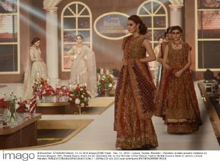 Dec. 11, 2015 - Lahore, Punjab, Pakistan - Pakistani models present creations by famous designer HSY, Shazia Kiyani, Aisha Imran, Zarmisha Dar on the first day of the Telenor Fashion Bridal Couture Week in Lahore. Lahore Pakistan - ZUMAp133