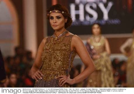 Dec. 11, 2015 - Lahore, Punjab, Pakistan - Pakistani models present creations by famous designer HSY, Shazia Kiyani, Aisha Imran, Zarmisha Dar on the first day of the Telenor Fashion Bridal Couture Week in Lahore. Lahore Pakistan - ZUMAp133
