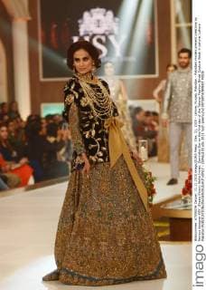 Dec. 11, 2015 - Lahore, Punjab, Pakistan - Pakistani models present creations by famous designer HSY, Shazia Kiyani, Aisha Imran, Zarmisha Dar on the first day of the Telenor Fashion Bridal Couture Week in Lahore. Lahore Pakistan - ZUMAp133