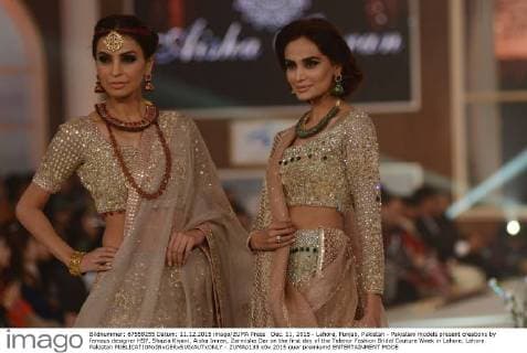 Dec. 11, 2015 - Lahore, Punjab, Pakistan - Pakistani models present creations by famous designer HSY, Shazia Kiyani, Aisha Imran, Zarmisha Dar on the first day of the Telenor Fashion Bridal Couture Week in Lahore. Lahore Pakistan - ZUMAp133