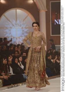 Dec. 11, 2015 - Lahore, Punjab, Pakistan - Pakistani models present creations by famous designer HSY, Shazia Kiyani, Aisha Imran, Zarmisha Dar on the first day of the Telenor Fashion Bridal Couture Week in Lahore. Lahore Pakistan - ZUMAp133