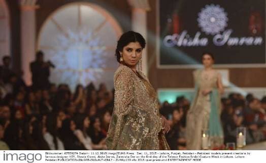 Dec. 11, 2015 - Lahore, Punjab, Pakistan - Pakistani models present creations by famous designer HSY, Shazia Kiyani, Aisha Imran, Zarmisha Dar on the first day of the Telenor Fashion Bridal Couture Week in Lahore. Lahore Pakistan - ZUMAp133