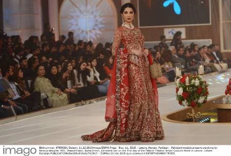 Dec. 11, 2015 - Lahore, Punjab, Pakistan - Pakistani models present creations by famous designer HSY, Shazia Kiyani, Aisha Imran, Zarmisha Dar on the first day of the Telenor Fashion Bridal Couture Week in Lahore. Lahore Pakistan - ZUMAp133
