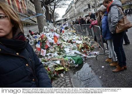 Dec. 13, 2015 - Paris, France - People in front of the Bataclan concert hall to put flowers and candle of lights in memorial of the victims of the terrorist attacks a month ago Paris, France on December 13, 2015 Paris France  - ZUMAn230