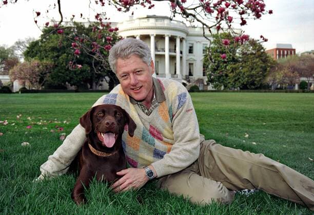 April 6, 1999 - Washington, DC, United States of America - US President Bill Clinton poses with his dog Buddy on the South Lawn of the Washington United States of America - ZUMAp138