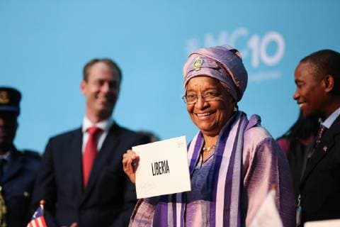 (151216) -- NAIROBI, Dec. 16, 2015 -- Liberian President Ellen Johnson Sirleaf shows an identification plate of her nation during the 10th World Trade Organization (WTO) ministerial conference in Nairobi, Kenya, on Dec. 16, 2015. The 10th World Trade Organization (WTO) ministerial conference that is being held in Nairobi, Kenya on Wednesday formally approved Liberia s membership after eight years of negotiations. ) KENYA-NAIROBI-WTO-MINISTERIAL CONFERENCE-LIBERIA-MEMBERSHIP PanxSiwei 