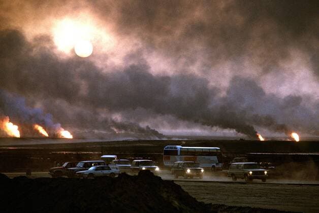 April 22, 1991 - Kuwait City, KUWAIT - Smoke from blazing oil wells in the aftermath of Operation Desert Storm cause drivers to use their headlights in the middle of the day April 22, 1991 in Kuwait City, Kuwait. The wells were set on fire by Iraqi forces before they were ousted from the region by coalition force. Kuwait City KUWAIT - ZUMAp138
