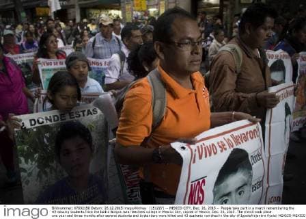 (151227) -- MEXICO CITY, Dec. 26, 2015 -- People take part in a march remembering the 43 missing students from the Isidro Burgos rural teachers college in Mexico City, capital of Mexico, Dec. 26, 2015. The march took place one year and three months after several students and bystanders were killed and 43 students vanished in the city of IgualaAlejandro Ayala) MEXICO-MEXICO CITY-MISSING STUDENTS-MARCH e AlejandroxAyala 