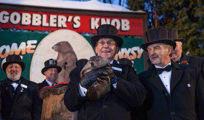 Feb. 1, 2015 - Punxsutawney, PA, United States of America - Groundhog handler Ron Ploucha holds famed weather prognosticating groundhog Punxsutawney Phil during the annual Grounghog Day winter forecast from Gobbler s Knob February 1, 2015 in Punxsutawney, Pennsylvania. Punxsutawney United States of America - ZUMAp138