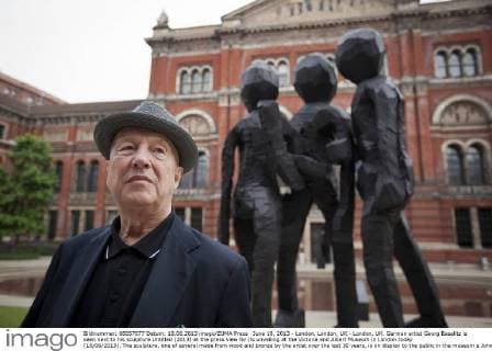 June 18, 2013 - London, London, UK - London, UK. German artist Georg Baselitz is seen next to his sculpture Untitled (2013) at the press view for its unveiling at the Victoria and Albert Museum in London today (18 06 2013). The sculpture, one of several made from wood and bronze by the artist over the last 30 years, is on display to the public in the museum s John Madejski Garden until the 8th of September 2013. Photo credit: Matt Cetti-Roberts LNP  - ZUMAl94