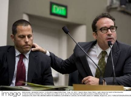 Aug. 13, 2013 - Sperm donor Jason Patric, right, places his hand on the shoulder of Daniel Carillho of Brazil who, like Patric was a sperm donor and is now fighting for the right to have a relationship with his biological child. Both men testified before the Assembly Committee on Judiciary at the state Capitol on Tuesday, August 13, 2013. - ZUMAs76