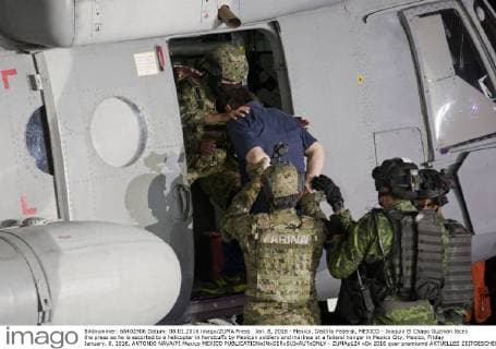 Jan. 8, 2016 - Mexico, Distrito Federal, MEXICO - Joaquin El Chapo Guzman faces the press as he is escorted to a helicopter in handcuffs by Mexican soldiers and marines at a federal hangar in Mexico City, Mexico, Friday January. 8, 2016. ANTONIO NAVA PI Mexico MEXICO - ZUMAp124