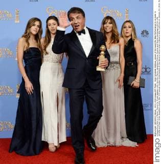 Actor Sylvester Stallone, winner of the award for Best Performance by an Actor in a Supporting Role in a Motion Picture for Creed appears with Jennifer Flavin, daughters Sistine, Scarlet and Sophia backstage with his wife Jennifer and their three daughters during the 73rd annual Golden Globe Awards at the Beverly Hilton Hotel in Beverly Hills, California on January 10, 2016.  LAP20160110950 JIMxRUYMEN