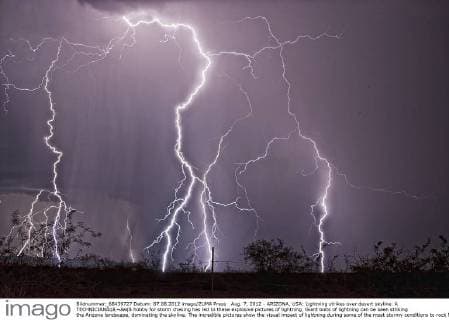 Aug. 7, 2012 - ARIZONA, USA: Lightning strikes over desert skyline. A TECHNICIANÃ¢â‚¬â„¢S hobby for storm chasing has led to these explosive pictures of lightning. Giant bolts of lightning can be seen striking the Arizona landscape, dominating the skyline. The incredible pictures show the visual impact of lightning during some of the most stormy conditions to rock North America. US-born technician, Steven Maguire (49) is a daring storm-chaser in his spare time Ã¢â‚¬œ and he describes the pictures he took of the lightning strikes captured in Arizona.  - ZUMAm14