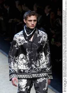 A model displays a creation as part of the Dolce & Gabbana men s Fall-Winter 2016-2017 show collection during Milan Fashion Week in Milan, Italy, on Jan. 16, 2016. Inspired by the iconic Spaghetti Western movies directed by an Italian director Sergio Leone in the 1960s, which brought the Italian movie industry to the attention of the international crowds, the collection shows a contrast between the past (via the embroideries and embellishments of the Wild West) and the present (the shapes, cut, and fit). ) ITALY-MILAN-D&G-FASHION WEEK JinxYu 