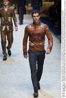 A model displays a creation as part of the Dolce & Gabbana men s Fall-Winter 2016-2017 show collection during Milan Fashion Week in Milan, Italy, on Jan. 16, 2016. Inspired by the iconic Spaghetti Western movies directed by an Italian director Sergio Leone in the 1960s, which brought the Italian movie industry to the attention of the international crowds, the collection shows a contrast between the past (via the embroideries and embellishments of the Wild West) and the present (the shapes, cut, and fit). ) ITALY-MILAN-D&G-FASHION WEEK JinxYu 