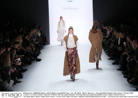 Jan. 20, 2016 - Berlin, Germany - Mercedes-Benz Fashion Week Autum Winter 2016 in Berlin. A model presents collection of RIANI. German based designer Lena Hoschek showcases the fashion house s latest collection at the Mercedes-Benz Fashion Week Berlin Autum Winter 2016. Berlin Germany - ZUMAp133