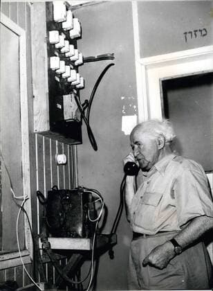 1962 - David Ben Gurion on telephone while visiting Sde Boker Kibbutz. - ZUMAk09_