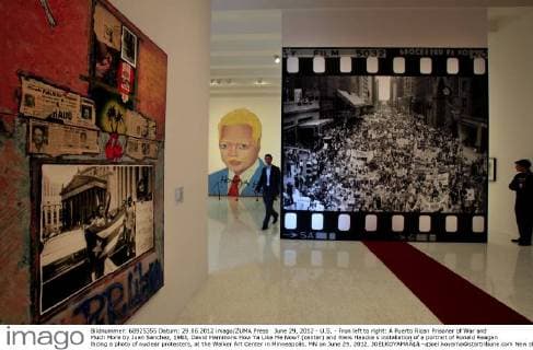 June 29, 2012 - U.S. - Fron left to right: A Puerto Rican Prisoner of War and Much More by Juan Sanchez, 1983, David Hammons How Ya Like Me Now? (center) and Hans Haacke s installation of a portrait of Ronald Reagan facing a photo of nuclear protesters, at the Walker Art Center in Minneapolis, MN on June 29, 2012. JOELKOYAMAÃ¢â‚¬¢joel.koyama@startribune.com New show of 1980s art surveys the obsessions with sex, gender issues,AIDs HIV, consumerism, and politics (through a filter of race,youthful alienation, irony). We need good pix for lede vis art story. Look esp for Haim Steinbach s installation with a big plush pumpkin, David Hammons How Ya Like Me Now? --a huge cut-out painting of a blond, white-faced Jesse Jackson, and Hans Haacke s installation of a portrait of Ronald Reagan facing a photo of nuclear protesters. - ZUMAm42_