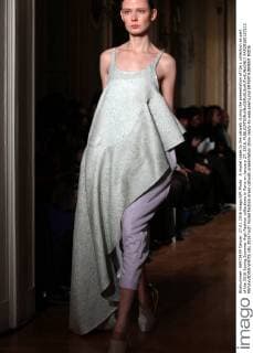A model takes to the catwalk during the presentation of Ilja s collection as part of the 2016 Spring Summer High Fashion collections in Paris on January 27, 2016.  PAR20160127112 MAYAxVIDON-WHITE