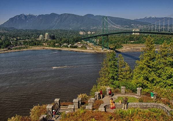 July 8, 2012 - Vancouver, British Columbia, CANADA - With the most spectacular panoramic views of the North Shore and its mountains, the Lions Gate Bridge and the Burrard Inlet, the Prospect Point Lookout in Stanley Park, Vancouver, is a must visit landmark destination for locals and visitors alike. A motorboat leaves a wake as it streaks through the inlet. - ZUMAd84_