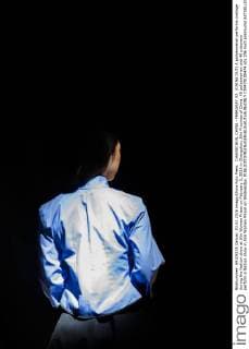 CHANGCHUN, CHINA - FEBRUARY 03: (CHINA OUT) A policewoman performs onstage during the fashion show at Jilin Women Prison on February 3, 2016 in Changchun, Jilin Province of China. 40 policewomen and 40 prisoners perform a fashion show in Jilin Women Prison on Wednesday.  CFP479100474