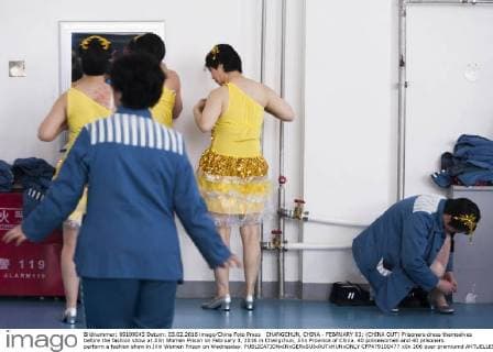 CHANGCHUN, CHINA - FEBRUARY 03: (CHINA OUT) Prisoners dress themselves before the fashion show at Jilin Women Prison on February 3, 2016 in Changchun, Jilin Province of China. 40 policewomen and 40 prisoners perform a fashion show in Jilin Women Prison on Wednesday.  CFP479100477