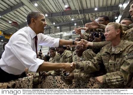 May 1, 2012 - Bagram Air Field, Afghanistan - President BARACK OBAMA greets U.S. troops following his remarks at Bagram Air Field, Afghanistan. President Barack Obama marked the anniversary of Osama bin Laden s death with a speedy trip to Afghanistan, signing a strategic pact with Kabul on Wednesday and delivering an election-year message to Americans that the war is winding down. Shortly after arriving under the cover of darkness, Obama and Afghan President Hamid Karzai signed a strategic partnership agreement at the Afghan leader s palace that sets out a long-term U.S. role in Afghanistan, including aid and advisers. - ZUMAz03_