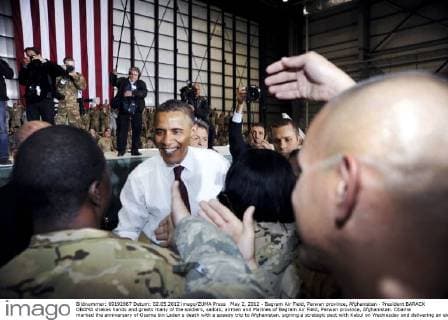 May 2, 2012 - Bagram Air Field, Parwan province, Afghanistan - President BARACK OBAMA shakes hands and greets many of the soldiers, sailors, airmen and Marines of Bagram Air Field, Parwan province, Afghanistan. Obama marked the anniversary of Osama bin Laden s death with a speedy trip to Afghanistan, signing a strategic pact with Kabul on Wednesday and delivering an election-year message to Americans that the war is winding down. Shortly after arriving under the cover of darkness, Obama and Afghan President Karzai signed a strategic partnership agreement at the Afghan leader s palace that sets out a long-term U.S. role in Afghanistan, including aid and advisers. - ZUMAz03_