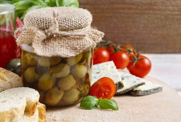 Glass jar of green olives. Italian style dish  bew1A9F694