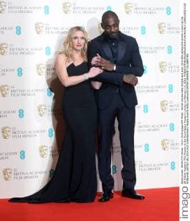 British actress Kate Winslet and actor Idria Elba attend the winner s room at the EE British Academy Film Awards at the Royal Opera House in London on February 14, 2016.  LON20160214120 RUNExHELLESTAD
