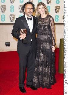 Feb. 14, 2016 - London, London, UK - London, UK. ALEJANDRO GONZALEZ INARRITU and wife MARIA ELANDIA HAGERMANN arrive carpet for the EE British Academy Film Awards 2016 after party held at Grosvenor House . London, UK. London UK  - ZUMAl94_