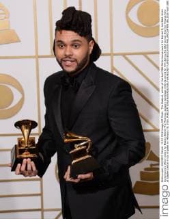 The Weeknd, winner of the Best R&B Performance award for Earned It, and Best Urban Contemporary Album award for Beauty Behind The Madness, appears backstage with the award for XXX during the 58th annual Grammy Awards held at Staples Center in Los Angeles on February 15, 2016.  LAP201602151038 PHILxMCCARTEN