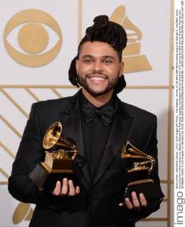 The Weeknd, winner of the Best R&B Performance award for Earned It, and Best Urban Contemporary Album award for Beauty Behind The Madness, appears backstage with the award for XXX during the 58th annual Grammy Awards held at Staples Center in Los Angeles on February 15, 2016.  LAP201602151044 PHILxMCCARTEN