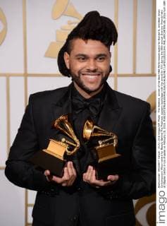 The Weeknd, winner of the Best R&B Performance award for Earned It, and Best Urban Contemporary Album award for Beauty Behind The Madness, appears backstage with the award for XXX during the 58th annual Grammy Awards held at Staples Center in Los Angeles on February 15, 2016.  LAP201602151041 PHILxMCCARTEN