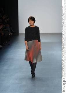 Designer Hiromi Asai greets the audience from the runway at the Hiromi Asai 2016 Collection at The Arc, Skylight at Moynihan Station during Fall 2016 New York Fashion Week on February 16, 2016 in New York City.  NYP20160216941 ANDREAxHANKS