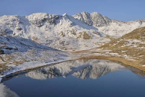Snowdonia Mountain range reflected in Llyn Teryn, North Wales, UK, April 2013.  1447990 PeterxxLewis